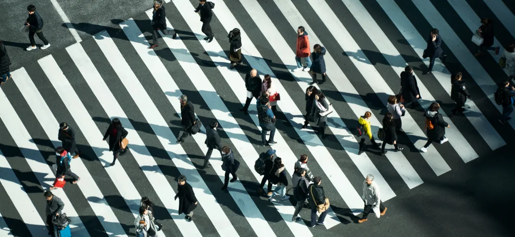 People crossing a large city crosswalk, representing diverse target audience groups