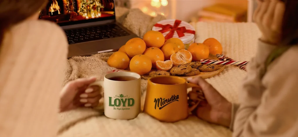 Minutka and Loyd tea packs on a festive table during a cozy family moment